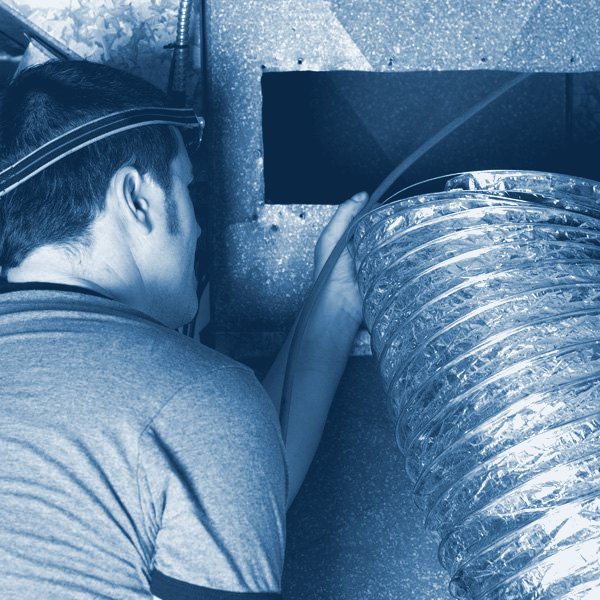 Technician fitting flexible ductwork
